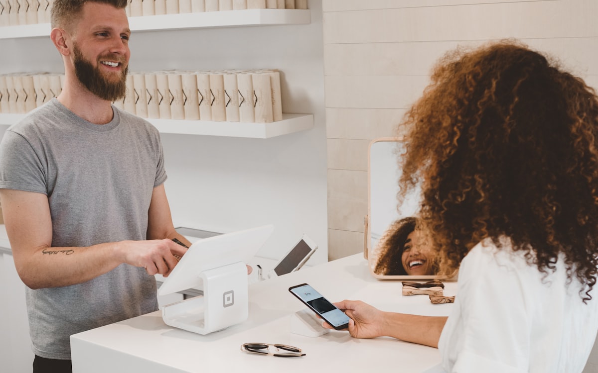 Contactless card payment being taken at a retail counter