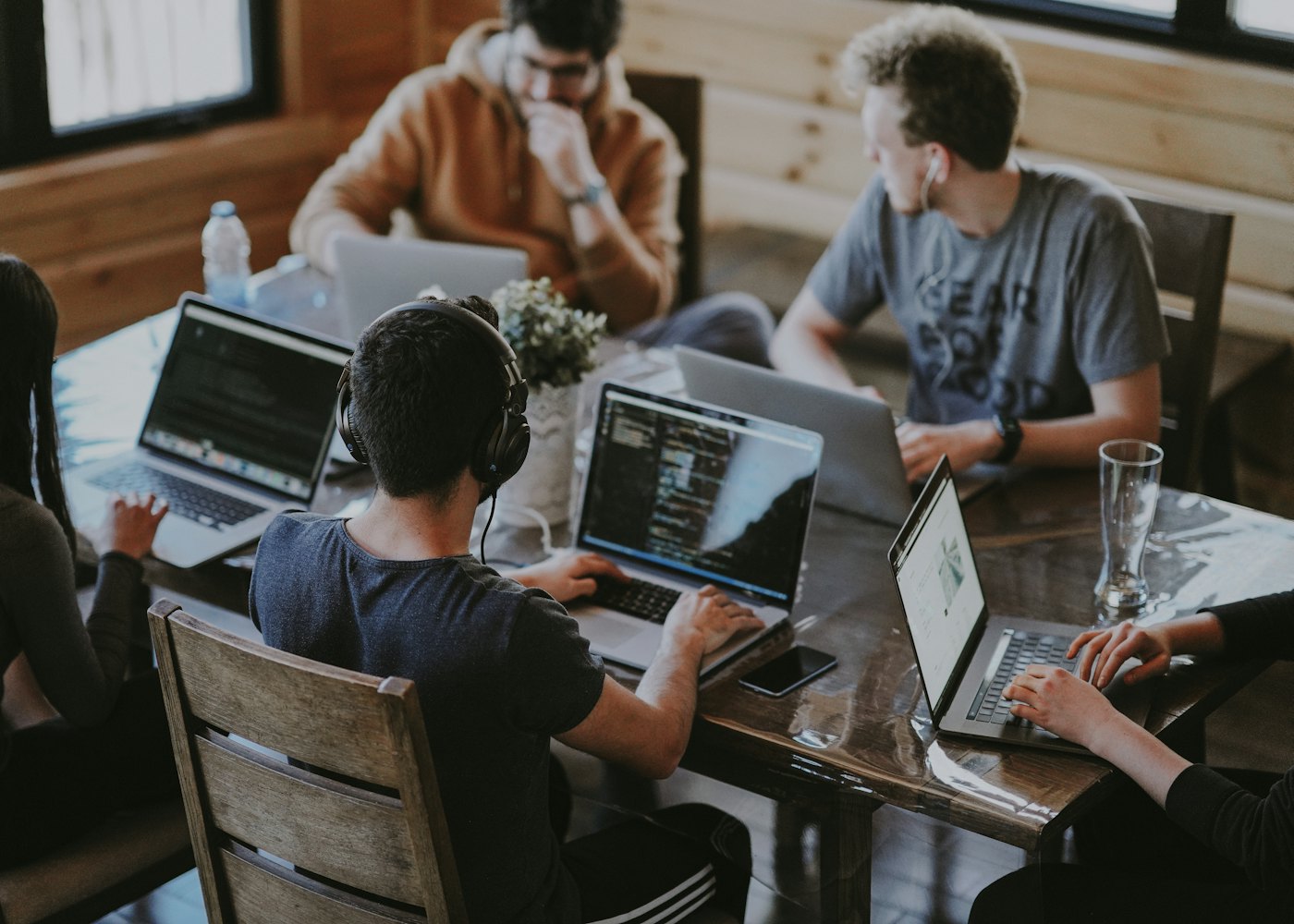 Skyrocket InfoSystem engineers working together at laptops